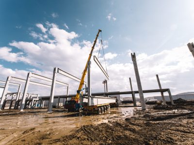 Details,Of,Construction,Site,With,Crane,Lifting,Prefabricated,Concrete,Framework,