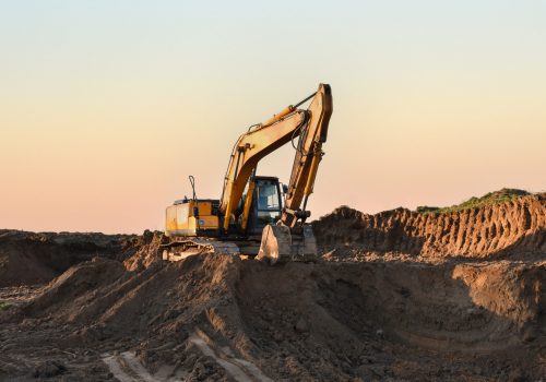 Excavator,In,Open,Pit,Mining.,Excavator,On,Earthmoving,On,Sunset.