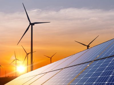 Wind,Turbine,With,Solar,Panels,And,Sunset.,Concept,Clean,Energy. Wind,Turbine,With,Solar,Panels,And,Sunset.,Concept,Clean,Energy.