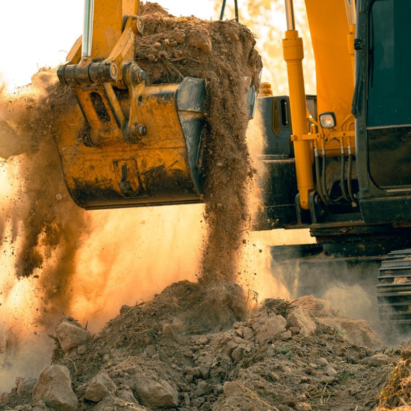 Close-up,Of,Excavator,At,Construction,Site.,Backhoe,Digging,Soil,For
